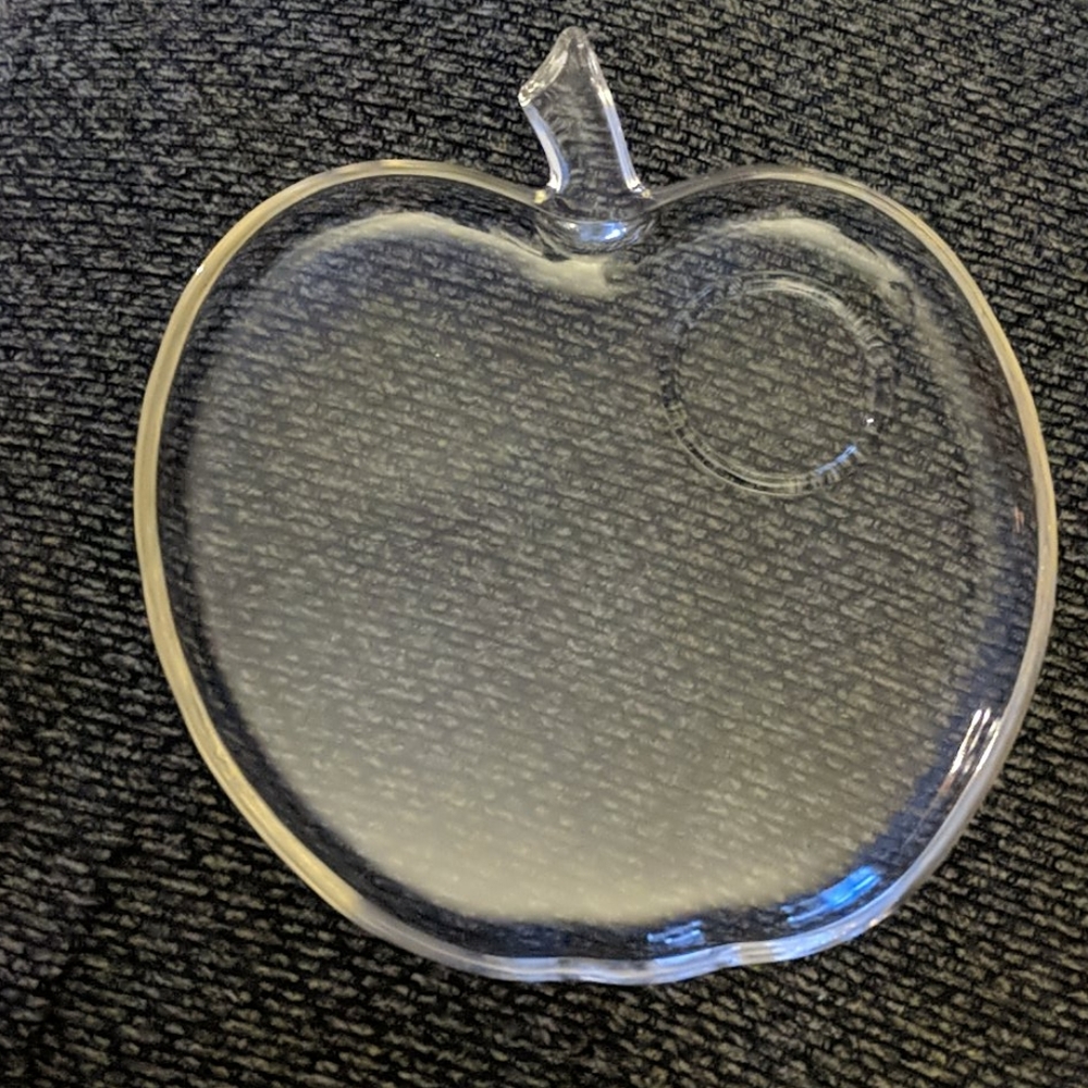 Four apple shaped plates with matching cups